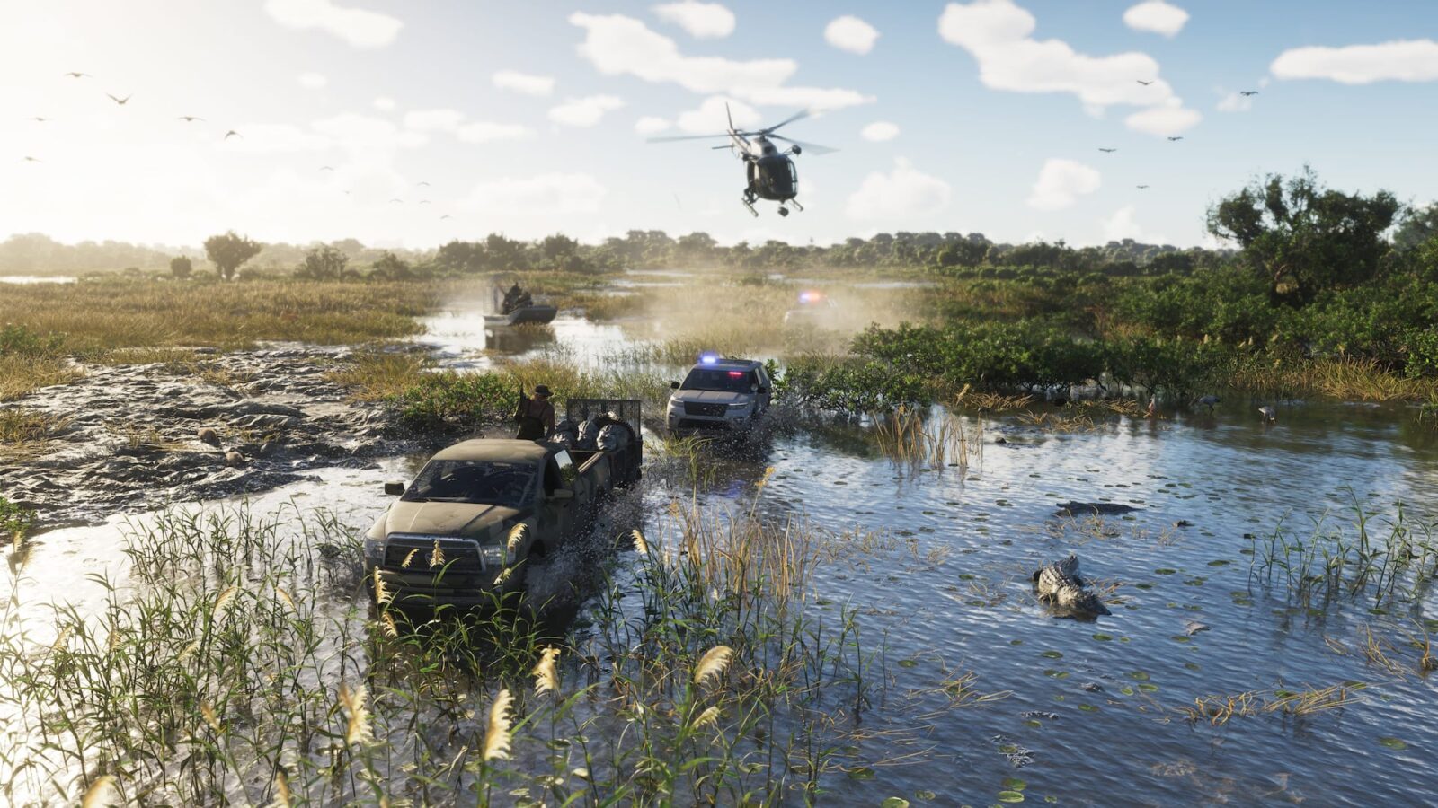 Official Grand Theft Auto VI image of a flooded marsh track where a pickup and a second vehicle drive through shallow water under a partly cloudy sky, with a helicopter overhead