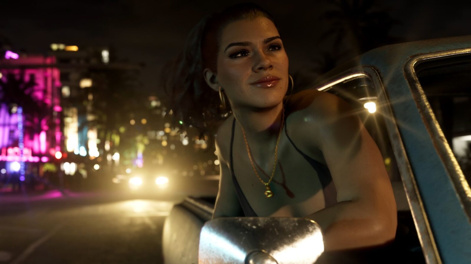 Official Grand Theft Auto VI image of Lucia leaning out of a car window on a neon-lit street at night