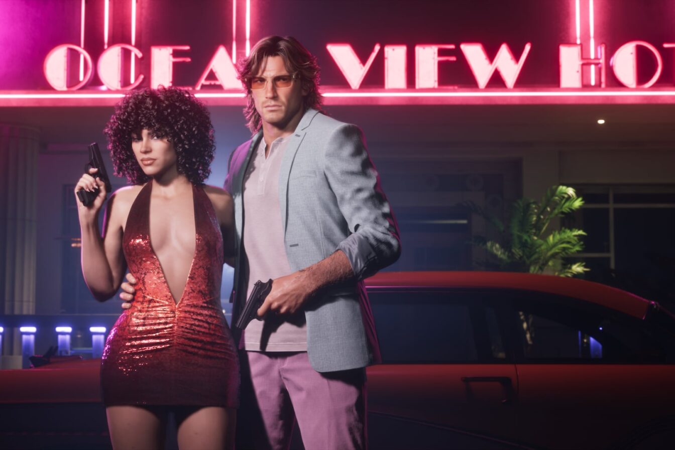 Official Grand Theft Auto VI image of Lucia and Jason posing in front of a neon Ocean View Hotel sign, from the Vintage Vice City Pack