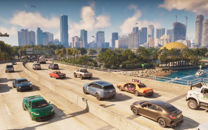 Official Grand Theft Auto VI screenshot of a busy Vice City bridge with the skyline behind it and branded vehicles in traffic, including a taxi with an ad on its roof