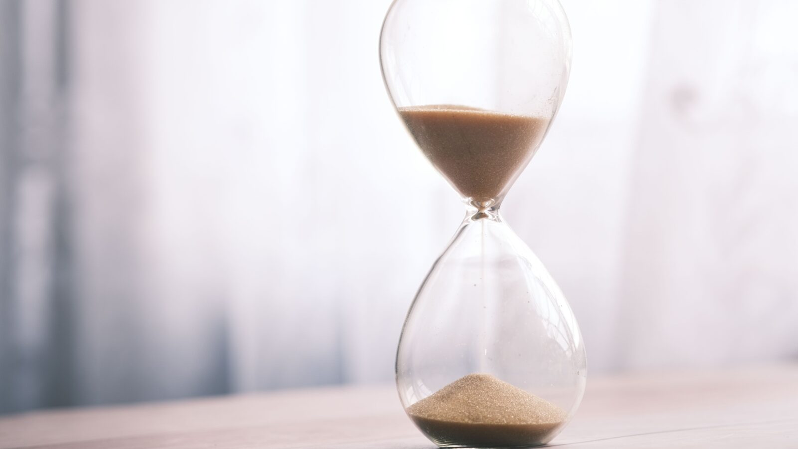 A wooden hourglass with sand steadily running through it, a quiet symbol of how long GTA 6 fans have been waiting